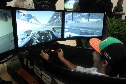 Checo Pérez at the Roshfrans activation with the APEX simulator at Mexico City airport
