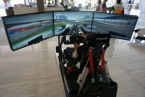 Guests competing on APEX simulators at the Force India event